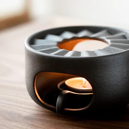 Vista 4 de Calentador de tetera de gres con cuchara de vela de seguridad, base de calentador de té de cerámica gruesa rústica con orificios de ventilación